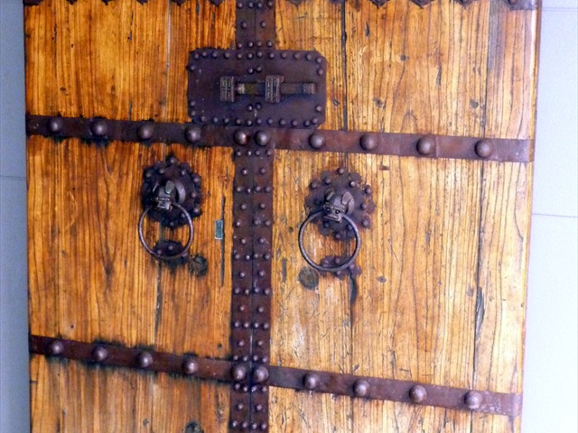 Varnishing an antique door at Vaucluse